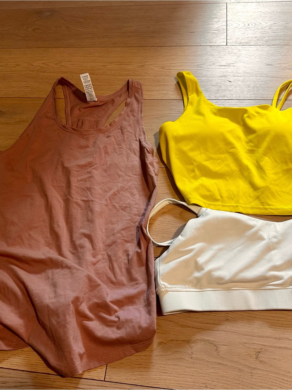 Women's mauve racer back tank and 2 bralette style tops